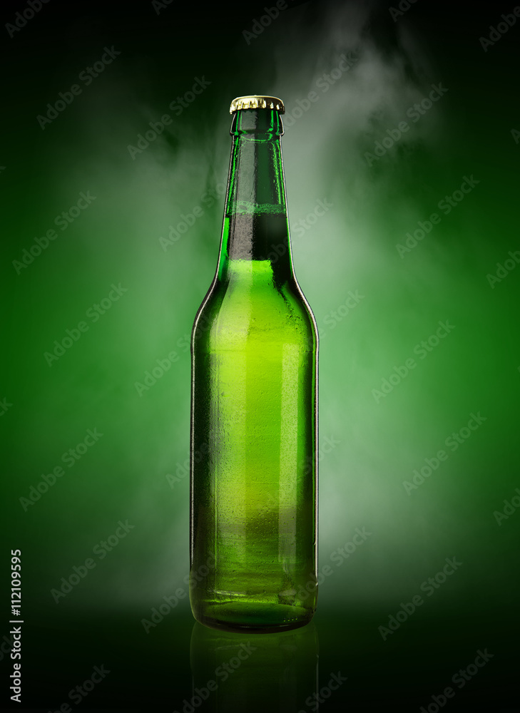 Cold wet beer bottle with frost and vapor Cold wet beer bottle with frost and vapor