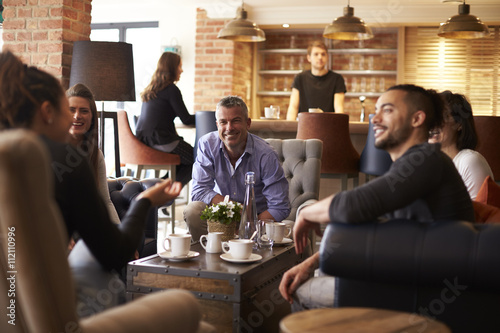 Group Of Friends Meeting For Coffee In Bar
