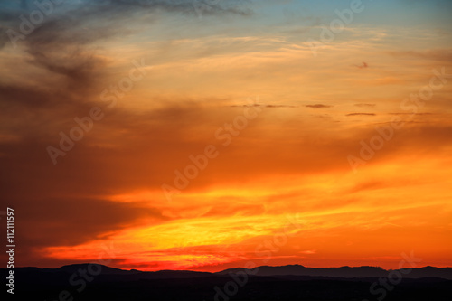 Vibrant sunset above landscape © viperagp