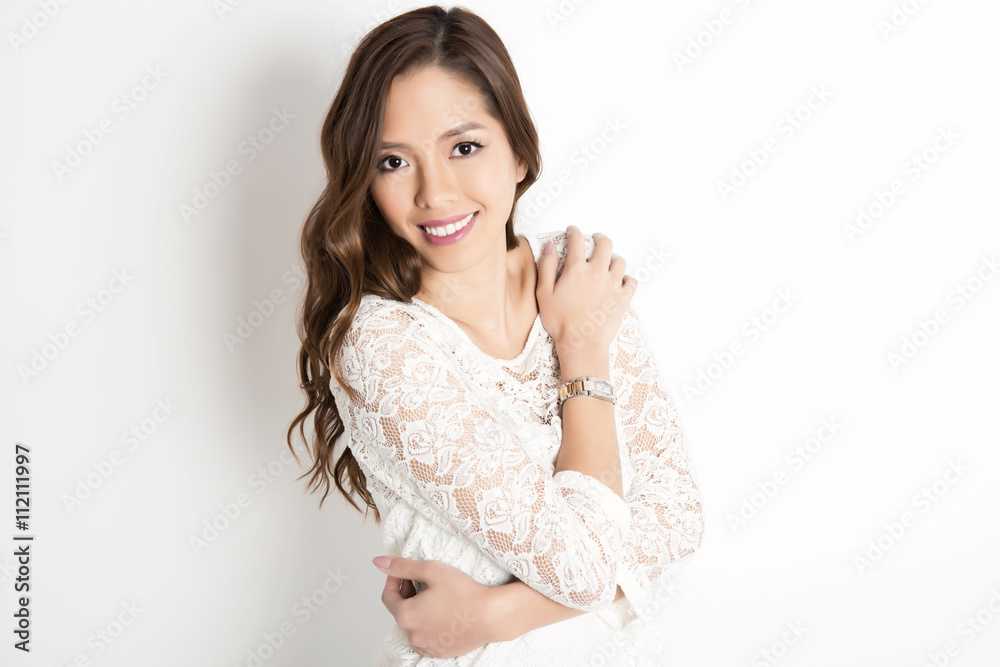 beautiful young asian woman with long hair posing in casual clothes and wearing a wrist watch beautiful young asian woman with long hair posing in casual clothes and wearing a wrist watch