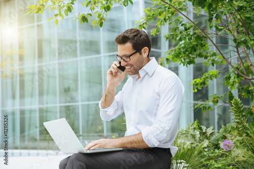 Tableau sur toile Businessman networking in financial district