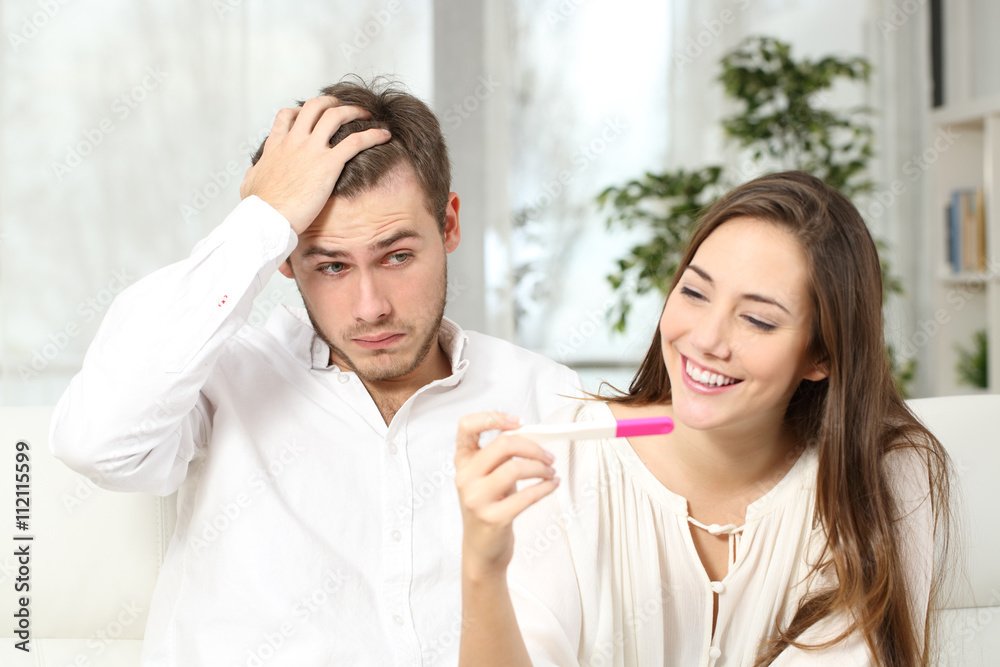 Worried man with pregnancy test Worried man with pregnancy test