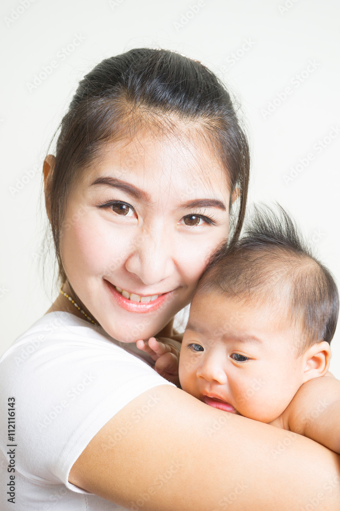 Happy mother holding adorable child baby boy Happy mother holding adorable child baby boy