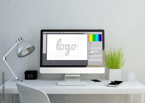 modern clean workspace with graphic design software on screen