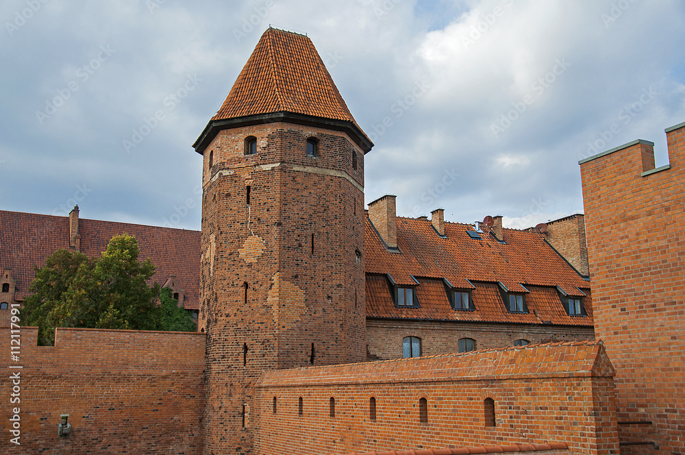 The tower and walls of a medieval castle of the Teutonic Order crusaders in Malbork, Poland