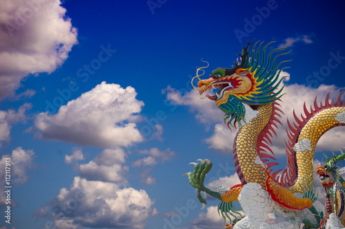 beautiful chinese dragon with blue sky background at thailand © amnadbumrungvong