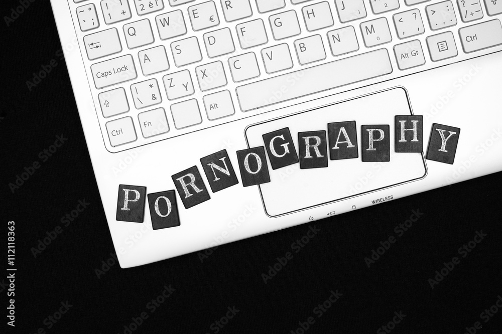 Black Internet - Porn and pornography - keyboard of laptop with letters. Internet as source  of videos and films with nudity and sexual content. Black and white with  copy space Stock Photo | Adobe Stock