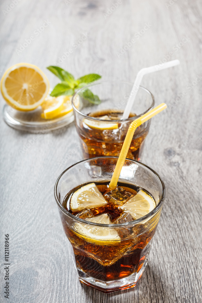The cooling drink with ice, lemon and mint. The cooling drink with ice, lemon and mint.