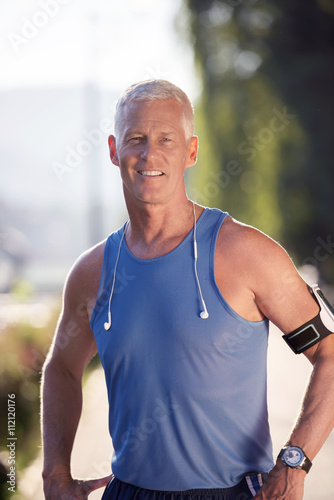 portrait of handsome senior jogging man