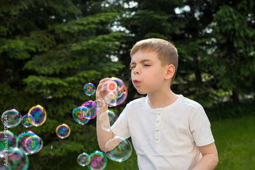 Child plating with soap bubbles