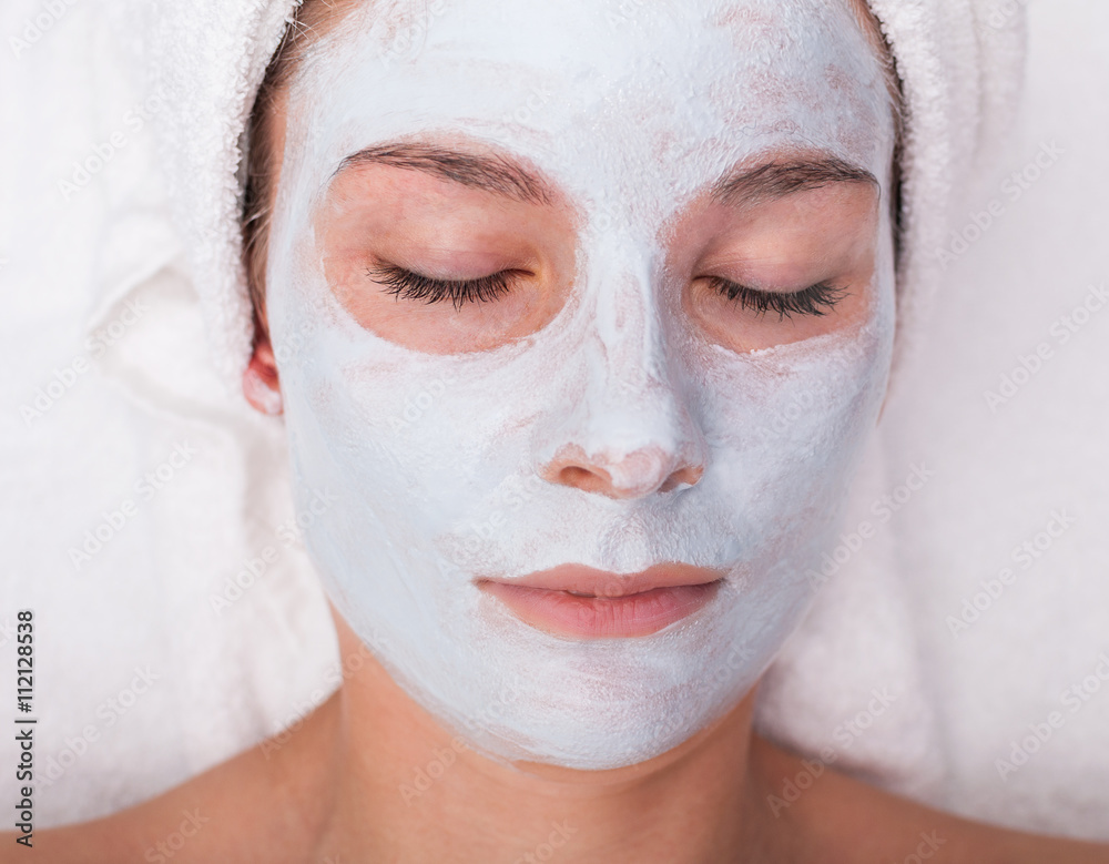Young woman with facial mask Young woman with facial mask