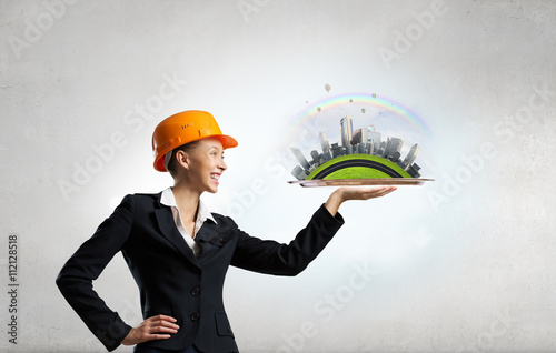 Woman presenting construction model photo