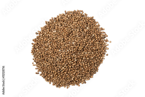 Isolated pile of dried coriander seed on a white background