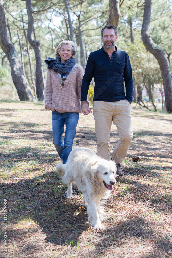 Middle aged couple walking near sea side Middle aged couple walking near sea side