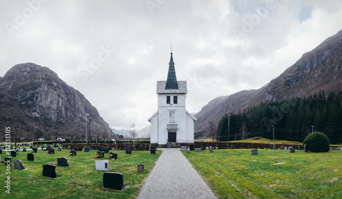 Beautiful white wooden Dirdal church among mountains in Rogaland, Norway. Panorama. photo