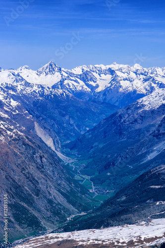 Fotografie Zermatt village among alps in aerial view