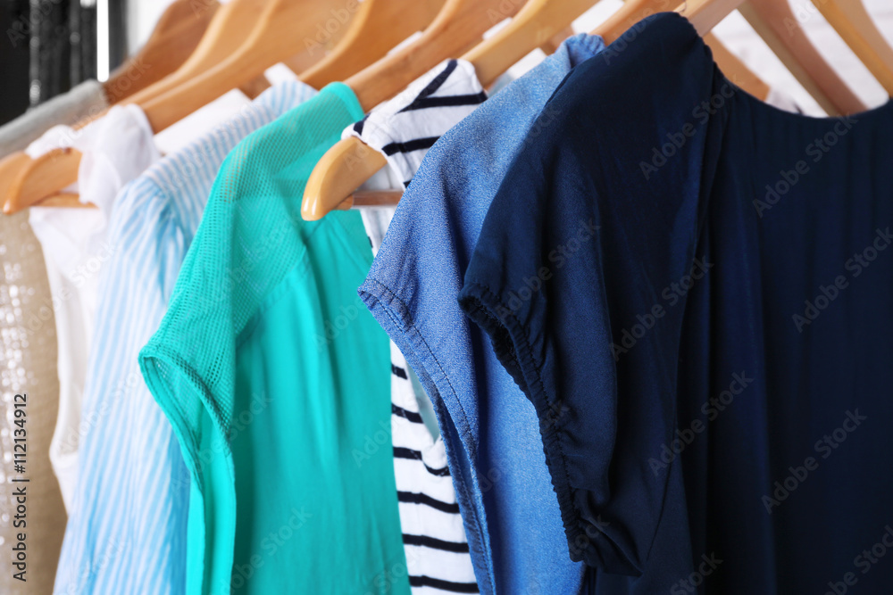 Obraz premium Collection of female clothes hanging on a rack