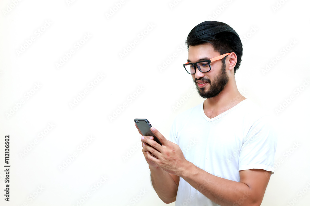 Asian handsome man with a mustache, smiling and laughing and usi Asian handsome man with a mustache, smiling and laughing and usi