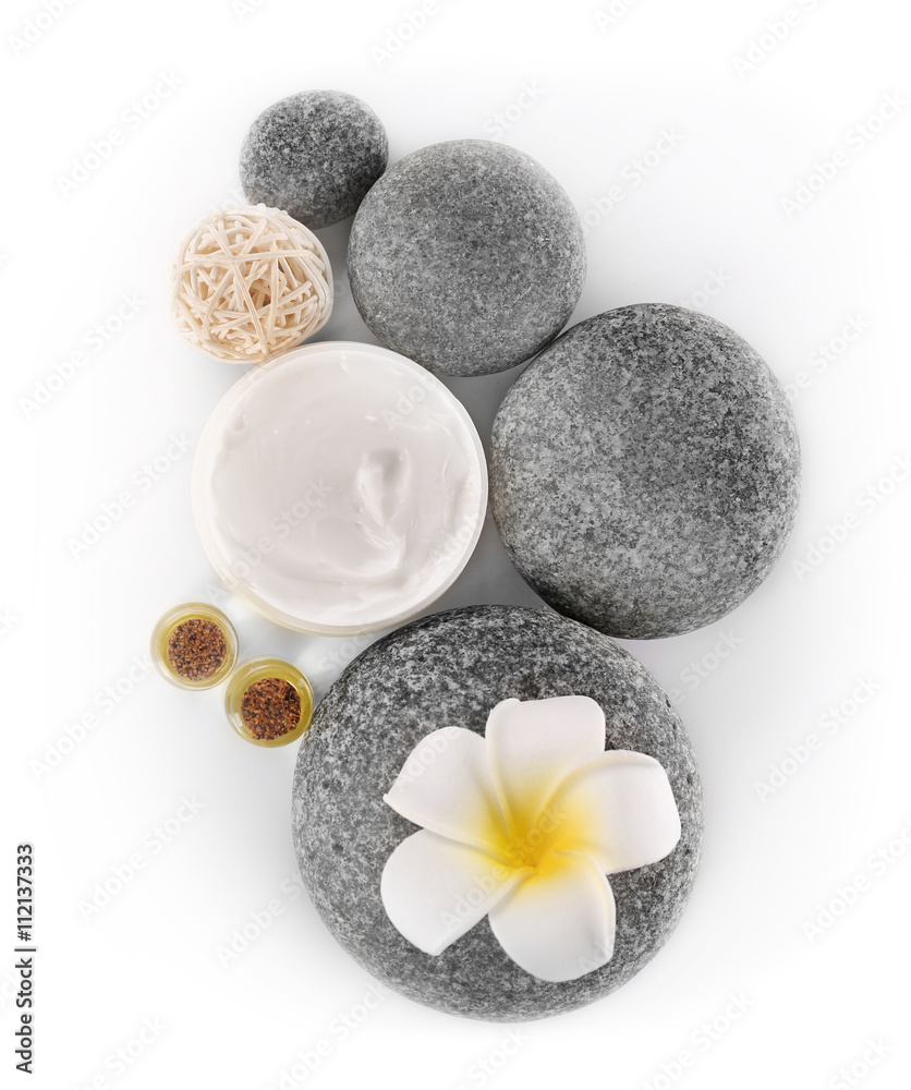 Spa treatment with stones and cream isolated on white Spa treatment with stones and cream isolated on white