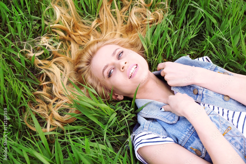 Young beautiful woman on green grass Young beautiful woman on green grass