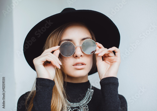 Hipster stunning woman making selfie , sending kiss, surprised funny emotions, natural make up, long blonde hairs, hipster hat and glasses, amity time, countryside. isolated
 photo