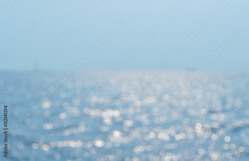 Fototapeta premium Blurred sea waves with bokeh light