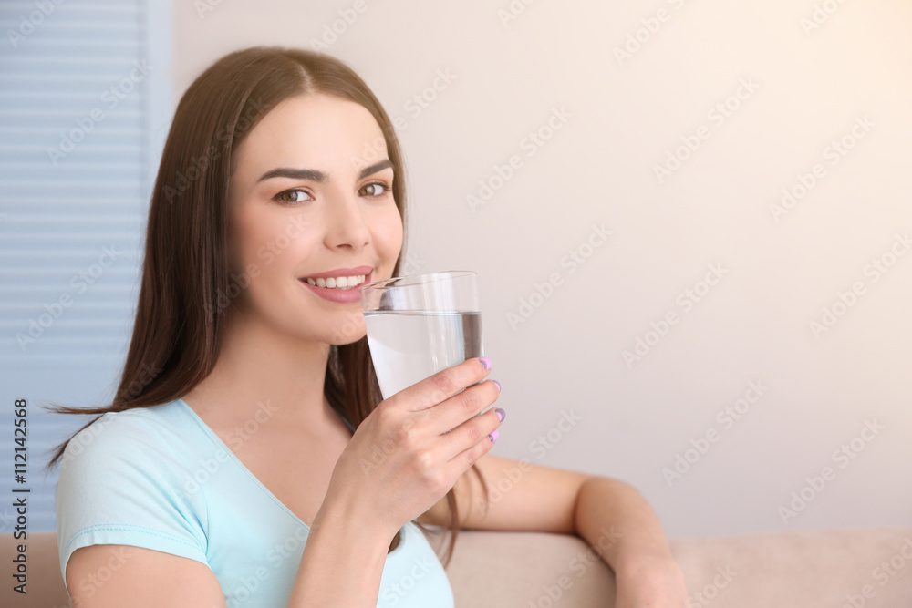 Beautiful girl drinking water