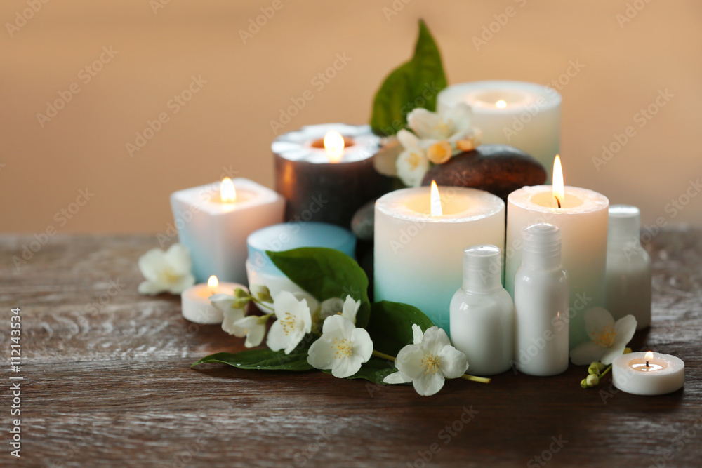 Spa composition with candles on blurred background