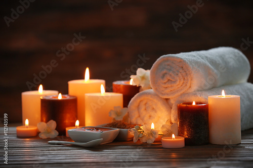 Spa composition with candles on blurred background