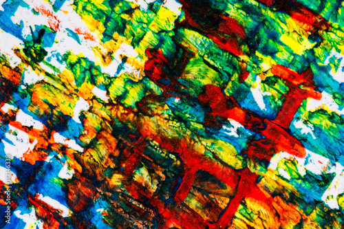 Closeup view of abstract hand painted lined colorful acrylic art background on paper texture. Fragment of artwork
