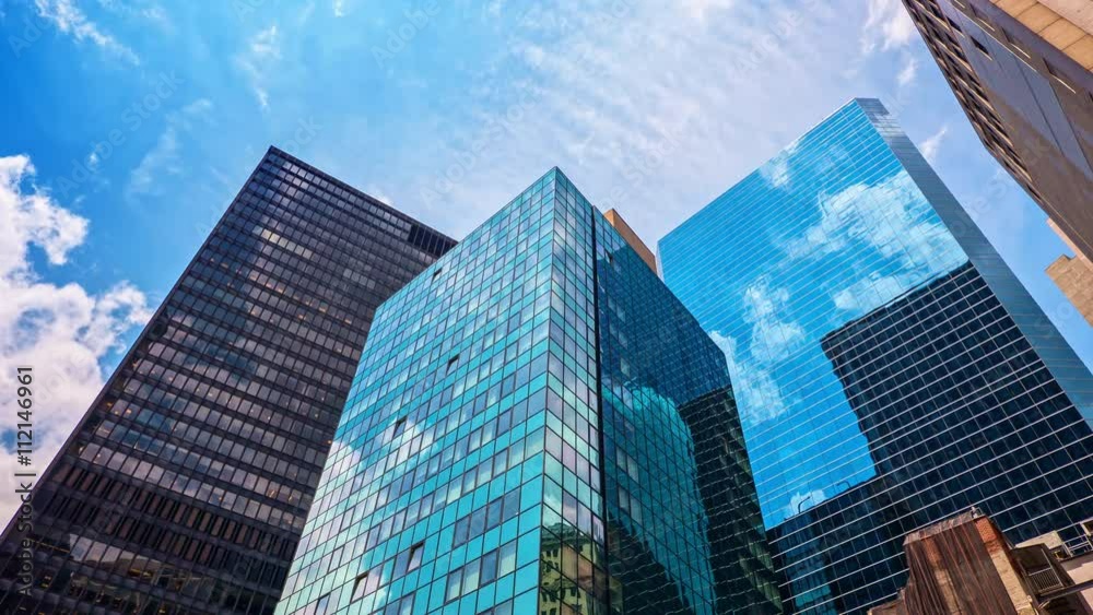 Skyscrapers blue sky reflection glass facades corporate buildings Manhattan New York City NYC