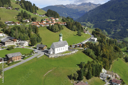 Tirol: Vogelschau der Barholomäus-Kirche in Schruns im Montafon photo