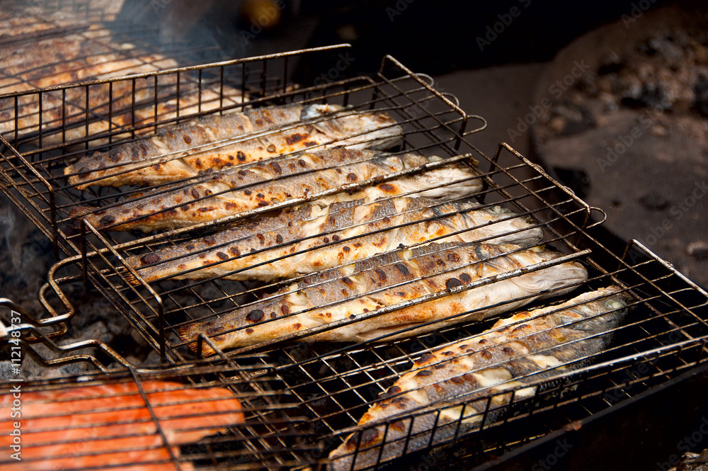Fish fried on a grill outdoors