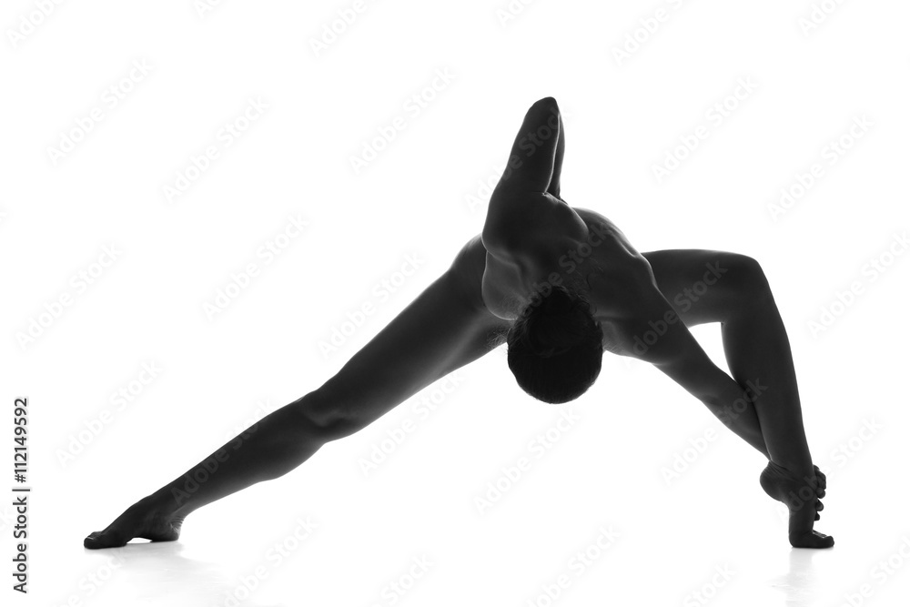 Naklejka premium Nude yoga. Artistic photos of beautiful sexy body of young woman with perfect figure. Isolated on white background