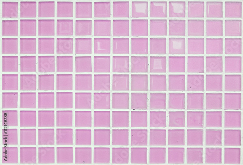 Closeup surface of pink glass tile at the temple wall texture background