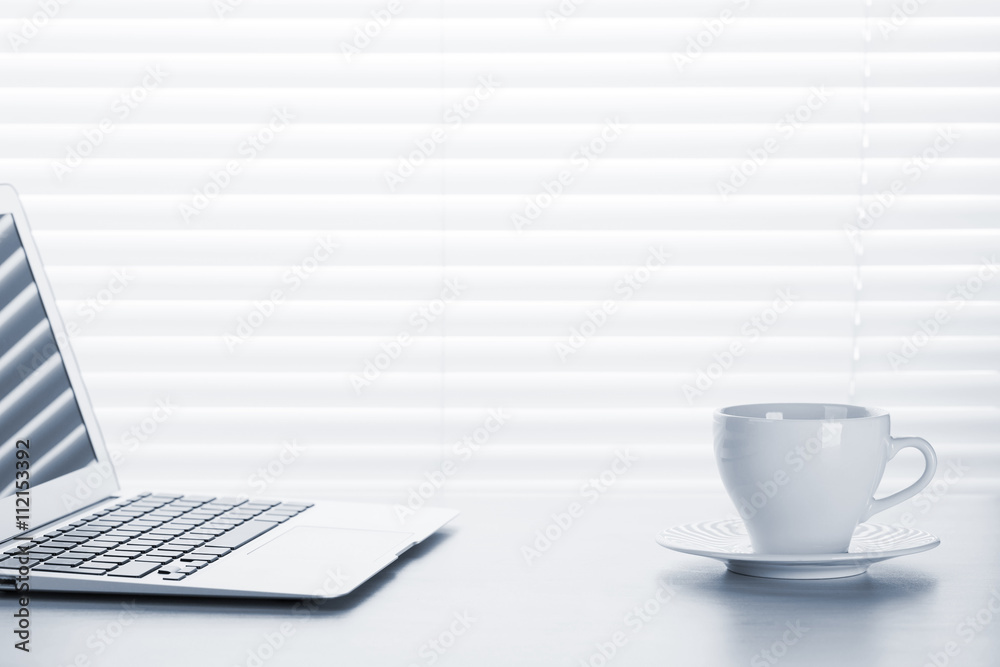 Fototapeta premium Office workplace with with laptop and coffee cup