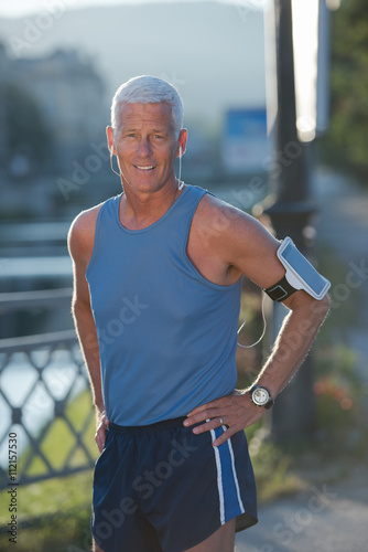 portrait of handsome senior jogging man © .shock