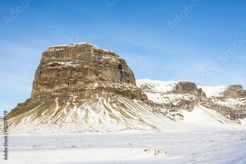 Fotografie Lomagnupur mountain.  Winter rural Icelandic landscape.