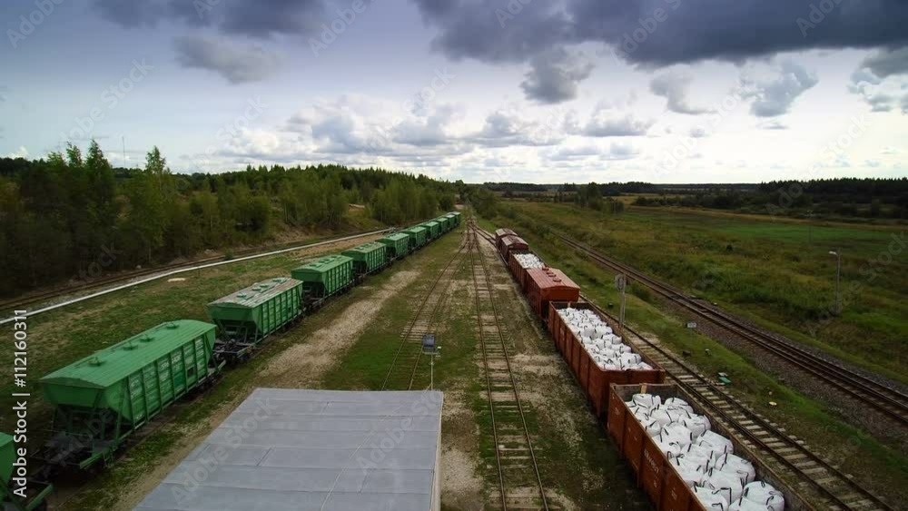 Long trail of train loaders on the railway. Found outside the limestone factory with lots of loads inside Long trail of train loaders on the railway. Found outside the limestone factory with lots of loads inside