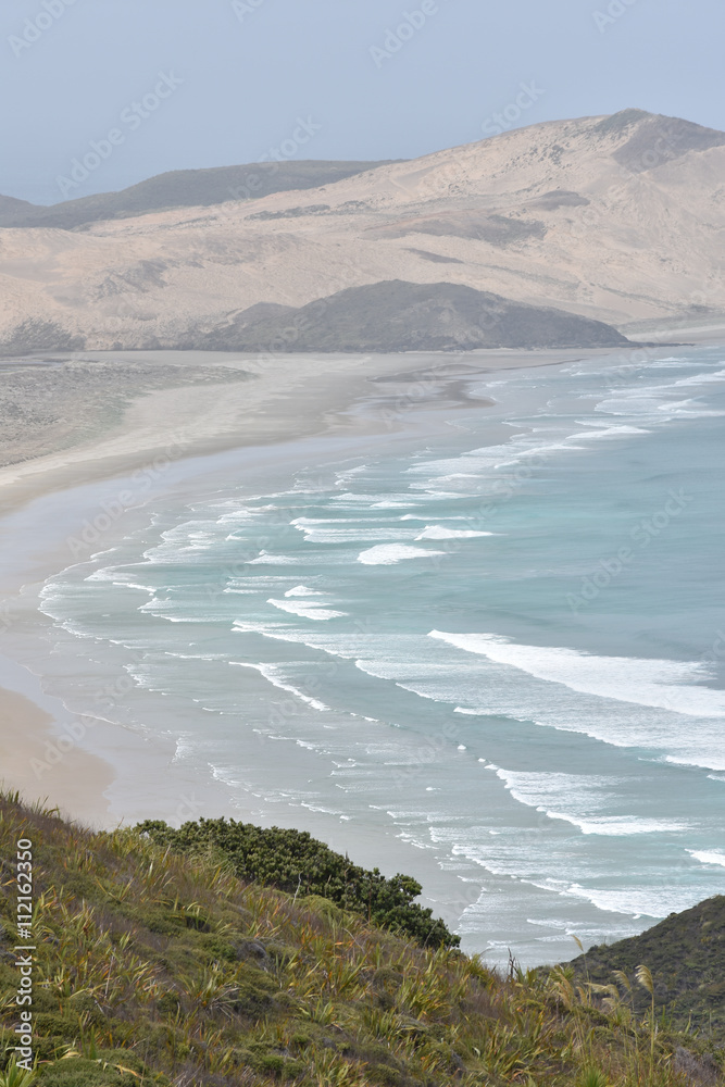 Naklejka premium Flat sandy beaches of most northern part of New Zealand at Cape Reinga.
