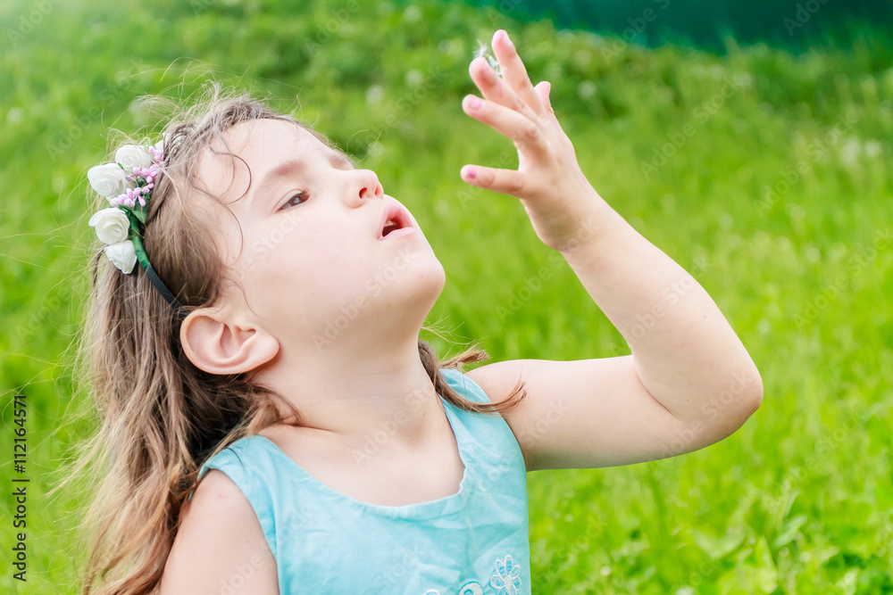 Beautiful child girl with dandelion flower in spring park. Happy Beautiful child girl with dandelion flower in spring park. Happy