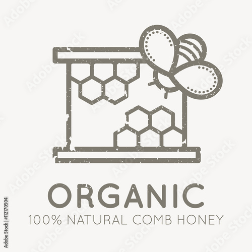 Beekeeping emblem with a honey bee on a honey comb