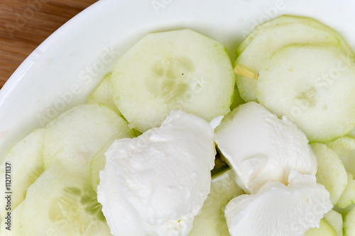 Cucumber salad with onions and cream