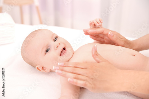 Mother hands applying cream...