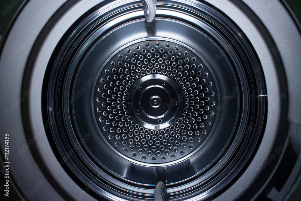 Looking inside a metal clothes dryer showing the concentric circles. Looking inside a metal clothes dryer showing the concentric circles.