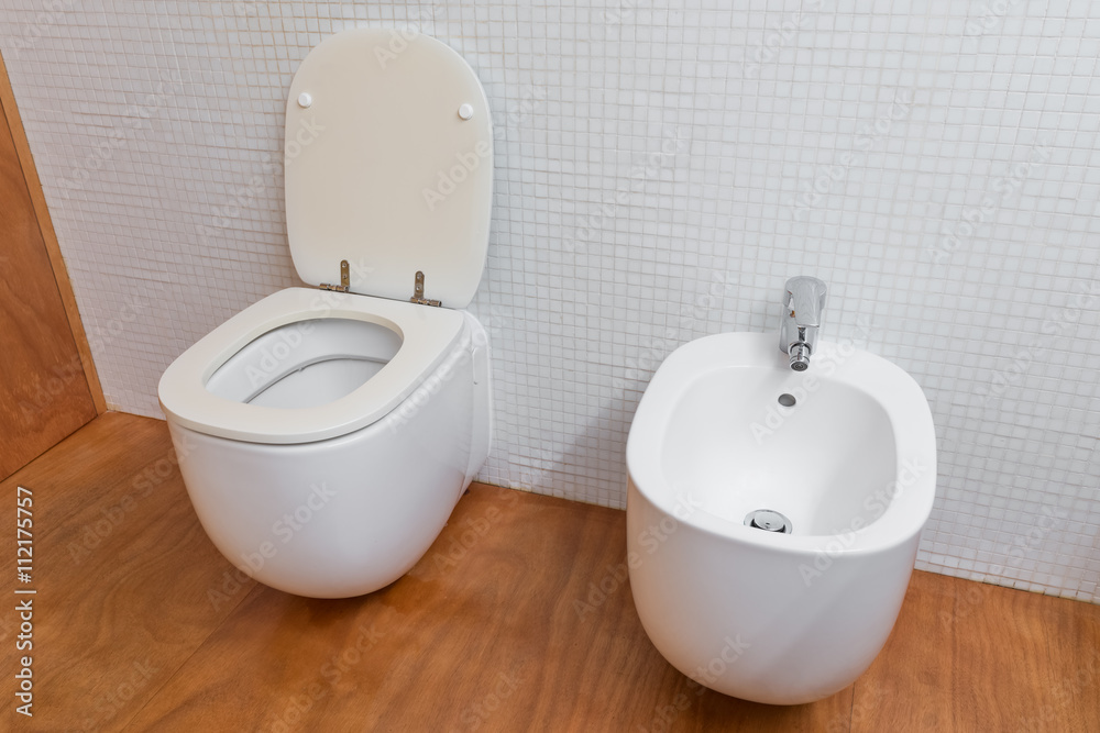 white toilet and bidet closeup
