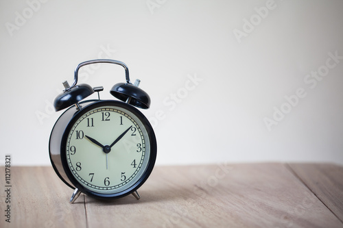 Alarm clock on wood table
