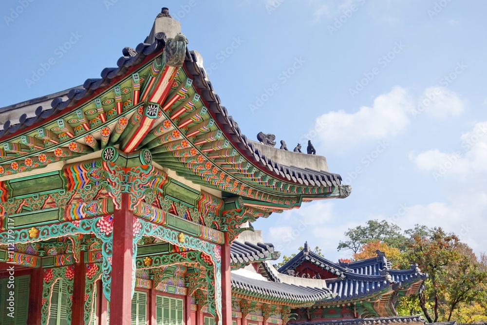 Korean traditional architecture. Roof detail of palace in Seoul. These places are major tourist attraction of South Korea.