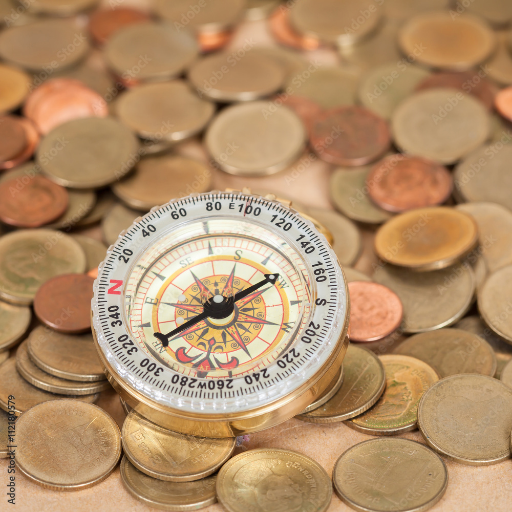 navigation compass with coins money , financial navigation compass with coins money , financial