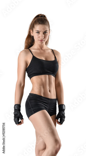 Cutout fitness lady showing torso stands and looks directly at the camera.